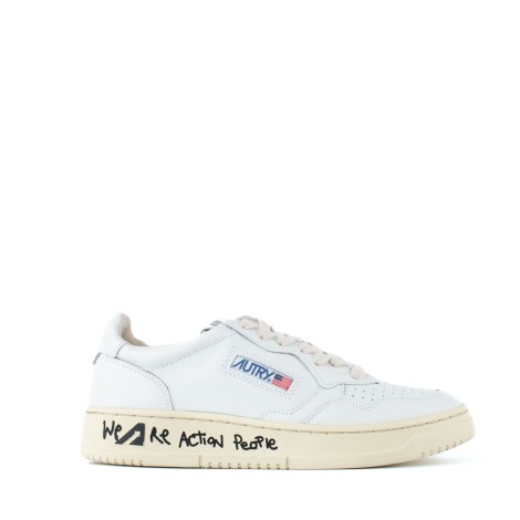 Sneakers pelle total white scritta suola