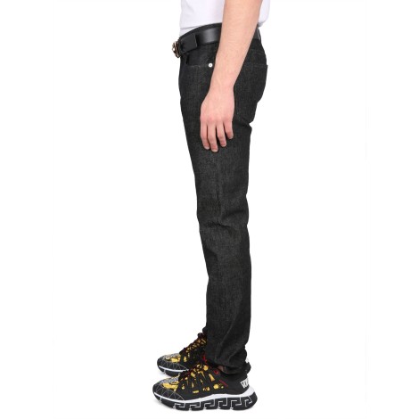 versace medusa studded jeans