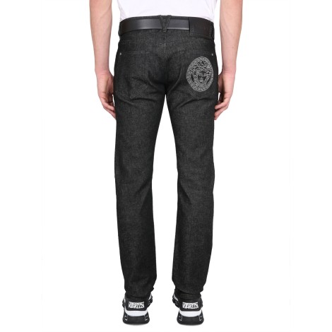 versace medusa studded jeans