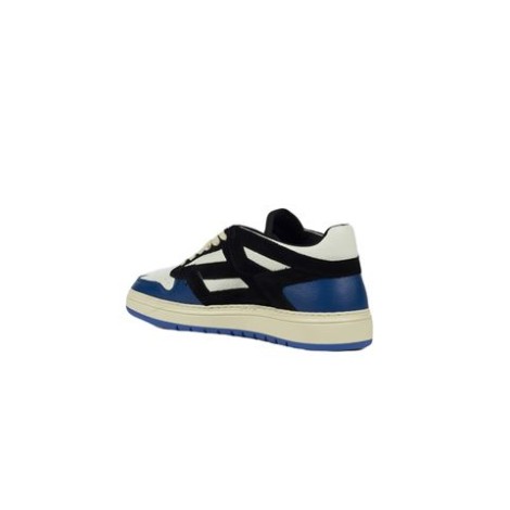 Sneakers REPTOR LOW di Represent, da uomo, colore nero e blu. Modello basso, realizzato con una tomaia in pelle e pelle scamosciata. Caratterizzato da suola in gomma, colletto imbottito e stringato. 