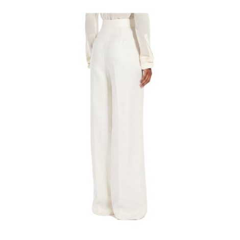 Pantalone HANGAR, di  Max Mara, da donna, colore bianco. Modello wide leg in leggero tessuto diagonale di puro lino. D'ispirazione sartoriale caratterizzata da linea ampia sulla gamba, piega stirata e tasche alla francese sui fianchi. Rifinito c