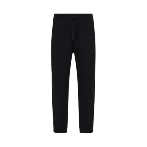 Pantalone di Emporio Armani, da uomo, colore nero. Modello jogger, coulisse alla vita e banda laterale. 