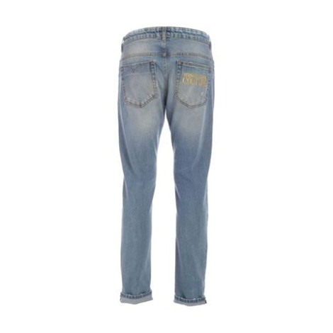 Jeans di Versace Jeans Couture, da uomo, colore denim. Realizzato in cotone stretch. Modello 5 tasche, con icamo logo lettering sul retro. Dettaglio etichetta logo. Dettagli effetto destroyed. Chiusura con zip e bottone logato. Passanti per cintura. 