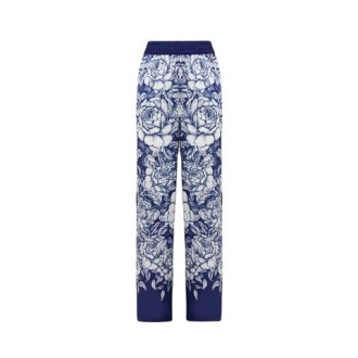 Pantalone di Blugirl, da donna, colore bianco e blu. Modello morbido con vita elasticizzata. Stampa rose a contrasto all-over. 